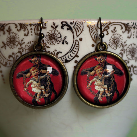Krampus the Christmas Demon Earrings- Krampus Carrying a Naughty Child by the Ears