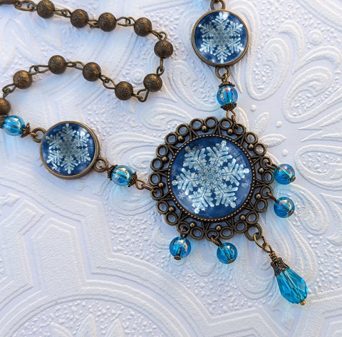 Ornate Snowflake Necklace with Images of Real Snowflakes Decoupaged under Glass in Bronze Filigree