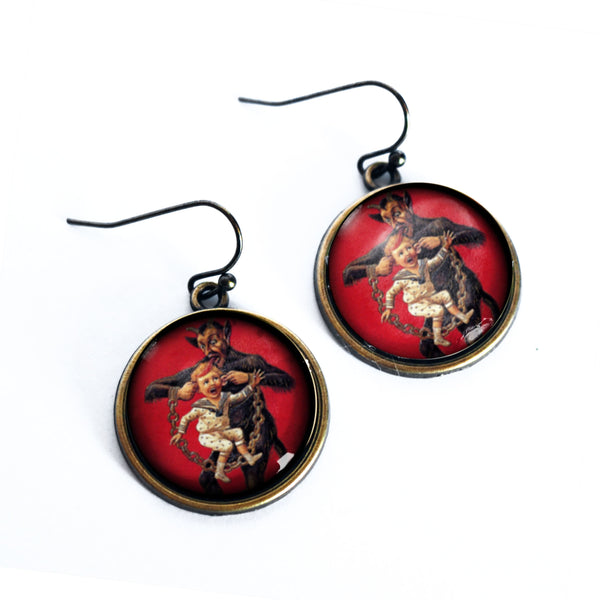 Krampus the Christmas Demon Earrings- Krampus Carrying a Naughty Child by the Ears