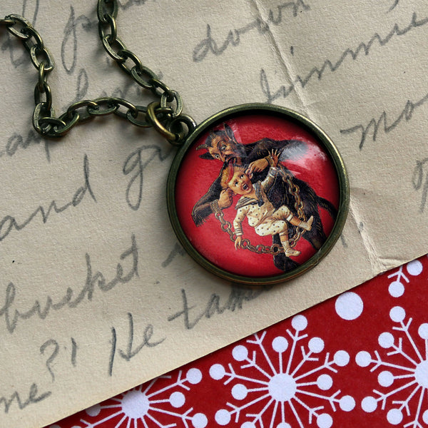 Krampus the Christmas Demon Large Pendant Necklace with Naughty Child Carried by the Ears