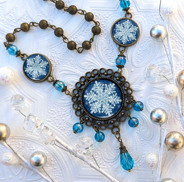 Ornate Snowflake Necklace with Images of Real Snowflakes Decoupaged under Glass in Bronze Filigree